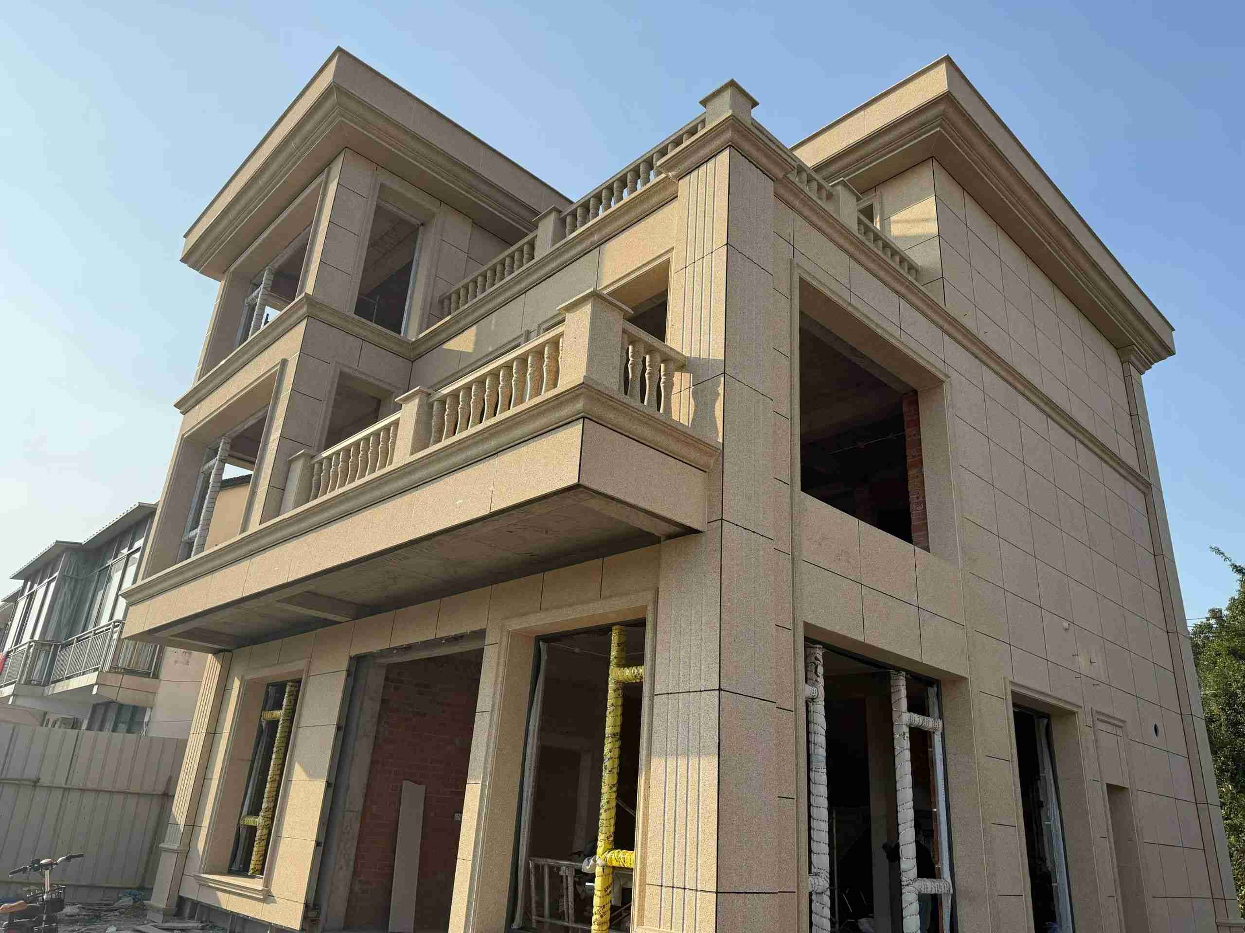 晋中 黄金麻花岗岩石材荔枝面外墙干挂效果展示